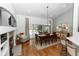 Dining room with modern chandelier, fireplace and screened patio access at 1412 Bent Oaks Blvd, Deland, FL 32724