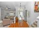Inviting foyer with hardwood floors, a staircase, and a view into a comfortable living area at 1412 Bent Oaks Blvd, Deland, FL 32724