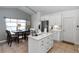 Open concept kitchen with stainless appliances, a center island, and breakfast nook area with lots of natural light at 1412 Bent Oaks Blvd, Deland, FL 32724