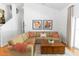 Inviting living room with a large sofa, hardwood floors and plenty of natural light at 1412 Bent Oaks Blvd, Deland, FL 32724