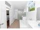 The ensuite bathroom features double sinks, a soaking tub, a stand up shower, and natural lighting at 1412 Bent Oaks Blvd, Deland, FL 32724