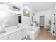 Bright and airy main bathroom with double sinks, tub, and plenty of natural light at 1412 Bent Oaks Blvd, Deland, FL 32724