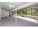Large screened porch featuring a ceiling fan for comfortable outdoor living at 1412 Bent Oaks Blvd, Deland, FL 32724