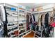 A large walk-in closet is equipped with custom shelving and hanging racks at 1412 Bent Oaks Blvd, Deland, FL 32724