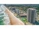Coastal condo complex on a sandy beach with ocean views and community pools at 1420 N Atlantic Ave # 202, Daytona Beach, FL 32118