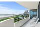 Balcony showcasing pool and ocean view at 1420 N Atlantic Ave # 202, Daytona Beach, FL 32118