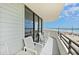 Relaxing oceanfront balcony featuring seating and scenic views at 1420 N Atlantic Ave # 202, Daytona Beach, FL 32118