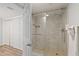 Modern bathroom showcasing a glass-enclosed shower with tiled walls and flooring at 1420 N Atlantic Ave # 202, Daytona Beach, FL 32118