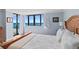 Inviting bedroom with a large window offering ocean view and a comfortable bed at 1420 N Atlantic Ave # 202, Daytona Beach, FL 32118