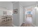 Hallway leading to ocean view bedroom with a dining area on the other side at 1420 N Atlantic Ave # 202, Daytona Beach, FL 32118