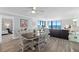 Open living space features dining area, comfortable living room furniture and ocean views at 1420 N Atlantic Ave # 202, Daytona Beach, FL 32118