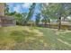 Expansive backyard featuring a wood fence, offering privacy and space for outdoor activities at 1562 Monroe St, Deland, FL 32720