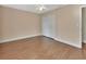 Cozy bedroom featuring wood floors, a closet, and neutral paint throughout at 1562 Monroe St, Deland, FL 32720