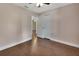 Bedroom with wood floors, closet, and open doorway to another room at 1562 Monroe St, Deland, FL 32720
