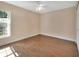 Bright bedroom with wood floors, a window providing natural light, and neutral wall color at 1562 Monroe St, Deland, FL 32720