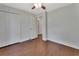 Spacious bedroom featuring hardwood floors and a closet with white doors at 1562 Monroe St, Deland, FL 32720
