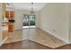 Bright dining area with tiled floor, sliding glass doors, and modern chandelier at 1562 Monroe St, Deland, FL 32720
