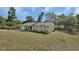 Charming single-story home with a well-manicured lawn and inviting curb appeal at 1562 Monroe St, Deland, FL 32720
