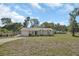 Charming single-story home with a well-maintained lawn and attached garage at 1562 Monroe St, Deland, FL 32720