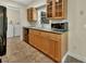 Kitchen featuring modern cabinets, stainless steel sink, and tile flooring at 1562 Monroe St, Deland, FL 32720