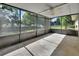 Screened lanai featuring a ceiling fan, ideal for enjoying the outdoors bug-free at 1562 Monroe St, Deland, FL 32720