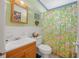 Bathroom featuring a floral shower curtain and wood vanity at 1608 Raleigh Ave, Daytona Beach, FL 32117