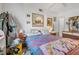 Cozy bedroom with a colorful quilt, ceiling fan, and artwork at 1608 Raleigh Ave, Daytona Beach, FL 32117