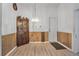 Dining room featuring wood paneling and hardwood floors at 1608 Raleigh Ave, Daytona Beach, FL 32117