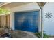 Blue garage door in need of some TLC at 1608 Raleigh Ave, Daytona Beach, FL 32117
