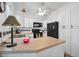 Bright kitchen with white cabinets, laminate countertops, and modern appliances at 1608 Raleigh Ave, Daytona Beach, FL 32117