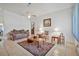Spacious living room with a decorative rug, furniture, and a ceiling fan at 1608 Raleigh Ave, Daytona Beach, FL 32117