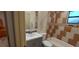 Bathroom featuring tiled shower-tub, vanity with sink, and modern fixtures at 1621 Anniston Ave, Daytona Beach, FL 32117