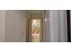 Hallway view leading to a bathroom featuring a tiled tub/shower and neutral tones at 1621 Anniston Ave, Daytona Beach, FL 32117