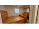 Spacious bedroom with natural light, wood floors, and a classic dresser with mirror at 1621 Anniston Ave, Daytona Beach, FL 32117