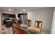 View of the kitchen, dining room area with stainless steel appliances and a glass table at 1621 Anniston Ave, Daytona Beach, FL 32117