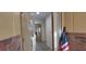 A view of the front door with decorative glass and an American flag hanging nearby at 1621 Anniston Ave, Daytona Beach, FL 32117