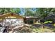 Charming single-story home with a two-car garage, landscaped yard and a mix of brick and siding exterior at 1621 Anniston Ave, Daytona Beach, FL 32117