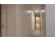 Hallway view leading to the bathroom with wood-look floors and neutral-toned walls at 1621 Anniston Ave, Daytona Beach, FL 32117