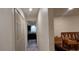 Hallway view leading into kitchen, showcasing dark cabinetry, and bright light fixtures at 1621 Anniston Ave, Daytona Beach, FL 32117