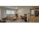 Cozy living room featuring neutral tones, wood-look floors, and a large window for ample natural light at 1621 Anniston Ave, Daytona Beach, FL 32117