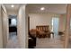 Open-concept living room showcasing modern flooring, neutral walls, and seamless transitions to other rooms at 1621 Anniston Ave, Daytona Beach, FL 32117