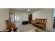 Spacious living room with wood floors, display furniture and a sitting area with a neutral color palette at 1621 Anniston Ave, Daytona Beach, FL 32117
