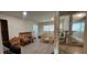 Inviting living room with wood-style flooring and comfortable seating, enhanced by a wall mirror at 1621 Anniston Ave, Daytona Beach, FL 32117