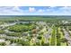 Wide aerial view of a community surrounding lakes and ponds at 1653 Promenade Cir, Port Orange, FL 32129