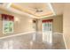 Bright bedroom with ceiling fan and large windows at 1653 Promenade Cir, Port Orange, FL 32129
