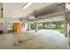 Large garage with ample space and an open door showcasing the property's exterior at 1653 Promenade Cir, Port Orange, FL 32129