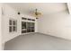Covered patio area with gray floors and neutral walls at 1653 Promenade Cir, Port Orange, FL 32129