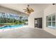 Covered patio with access to pool, screened enclosure, and outdoor seating at 1653 Promenade Cir, Port Orange, FL 32129