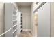 Spacious walk-in closet featuring custom shelving, providing ample storage in a well-organized space at 1653 Promenade Cir, Port Orange, FL 32129
