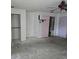 Bedroom showcasing multiple doors and potential closet spaces for functional living at 16880 Se 63Rd Ln, Ocklawaha, FL 32179